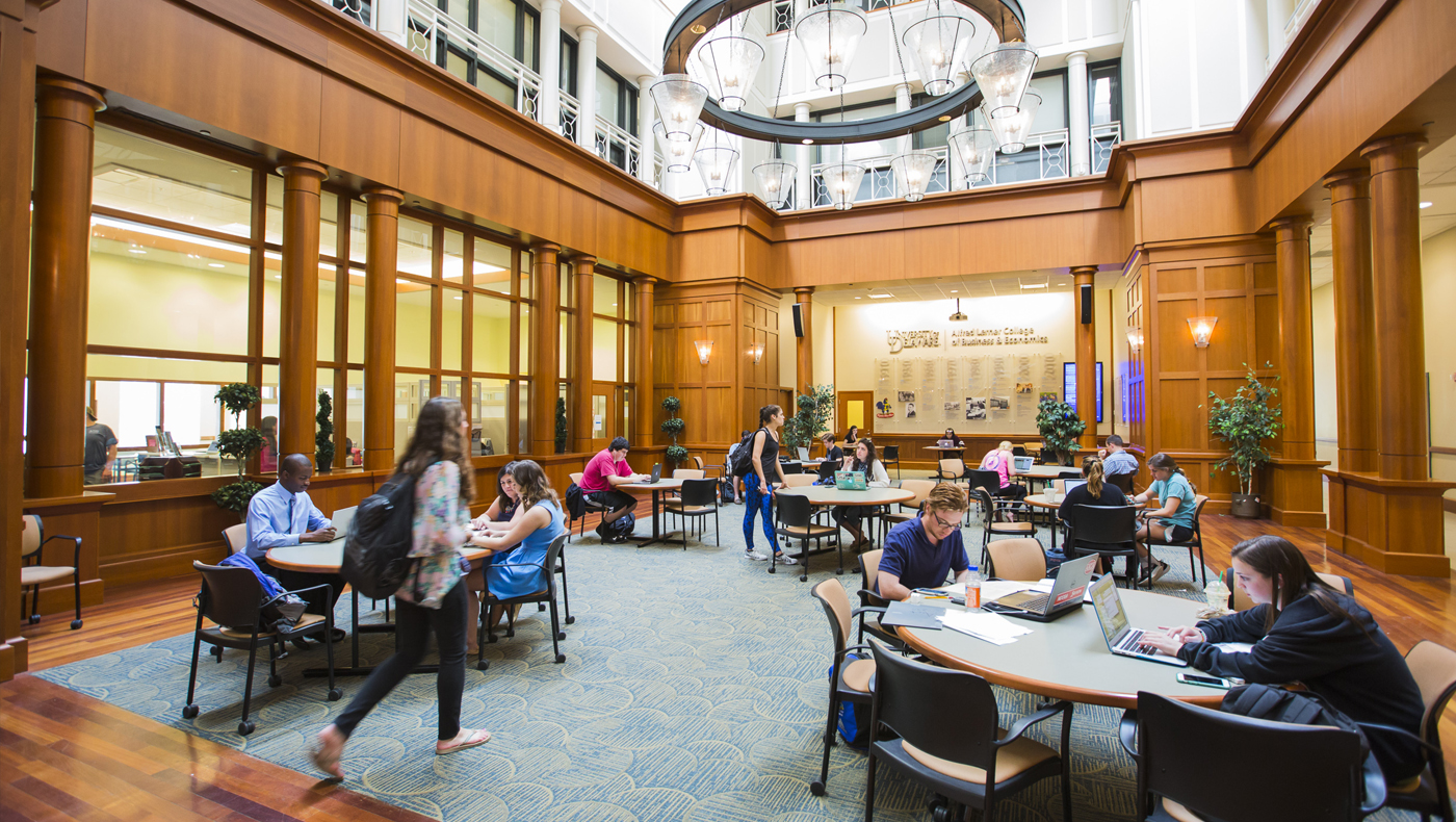 Students studying in the atrium of Lerner Hall.