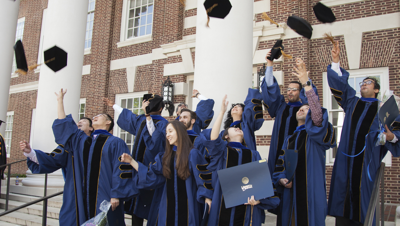 Lerner graduates celebrating at graduation.