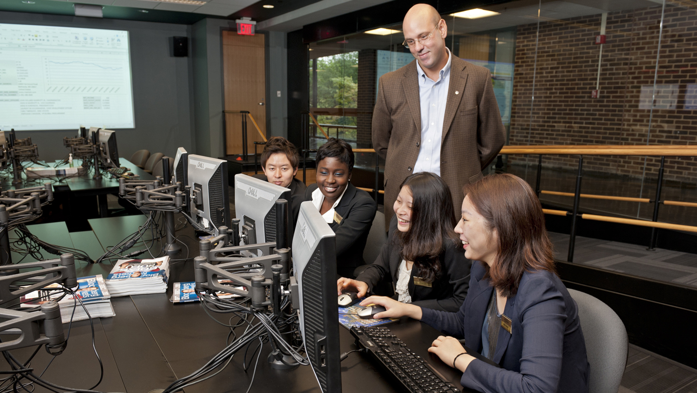 Several students working in a computer lab.