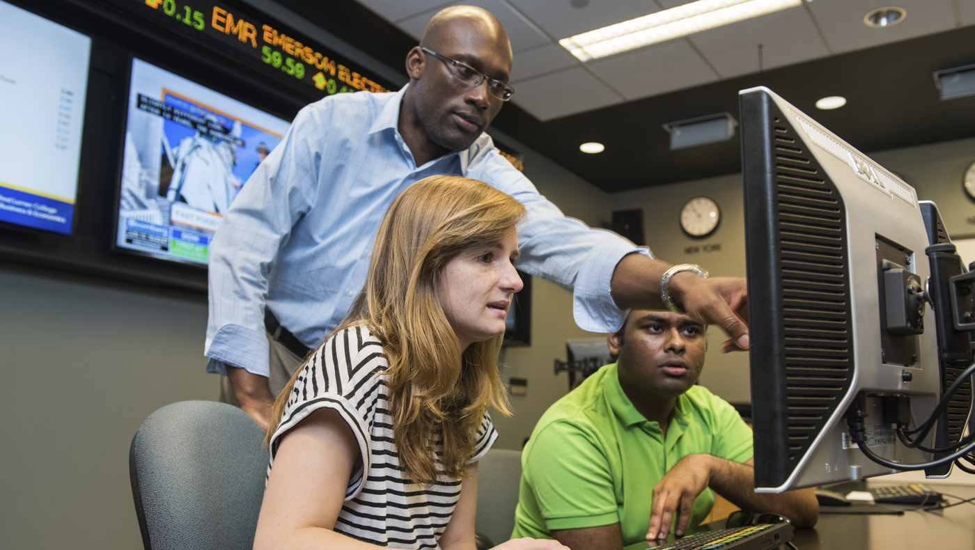 Students using the Michael and Rosann Geltzeiler Trading Center.