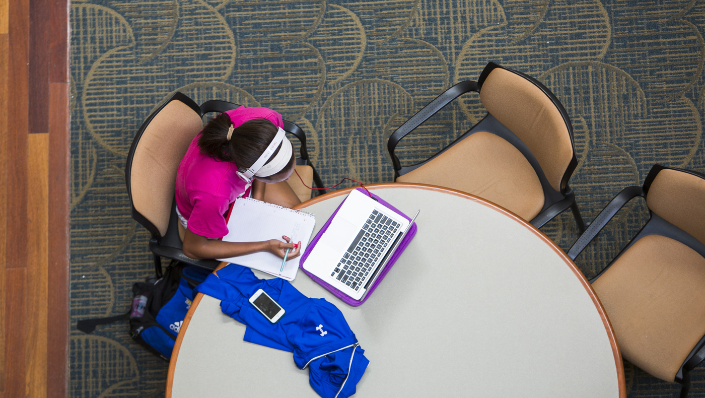 A student working on her laptop.