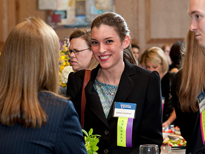 An HBM student at a networking event.