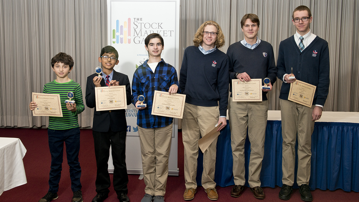 Winners of the fall 2018 Stock Market Game Chase McGinley, Sean Kennedy, Anthony Stidham-Mills, Daniel Davis, Shaun Huebler and Christian Newman-Sanders stand together at the awards ceremony.
