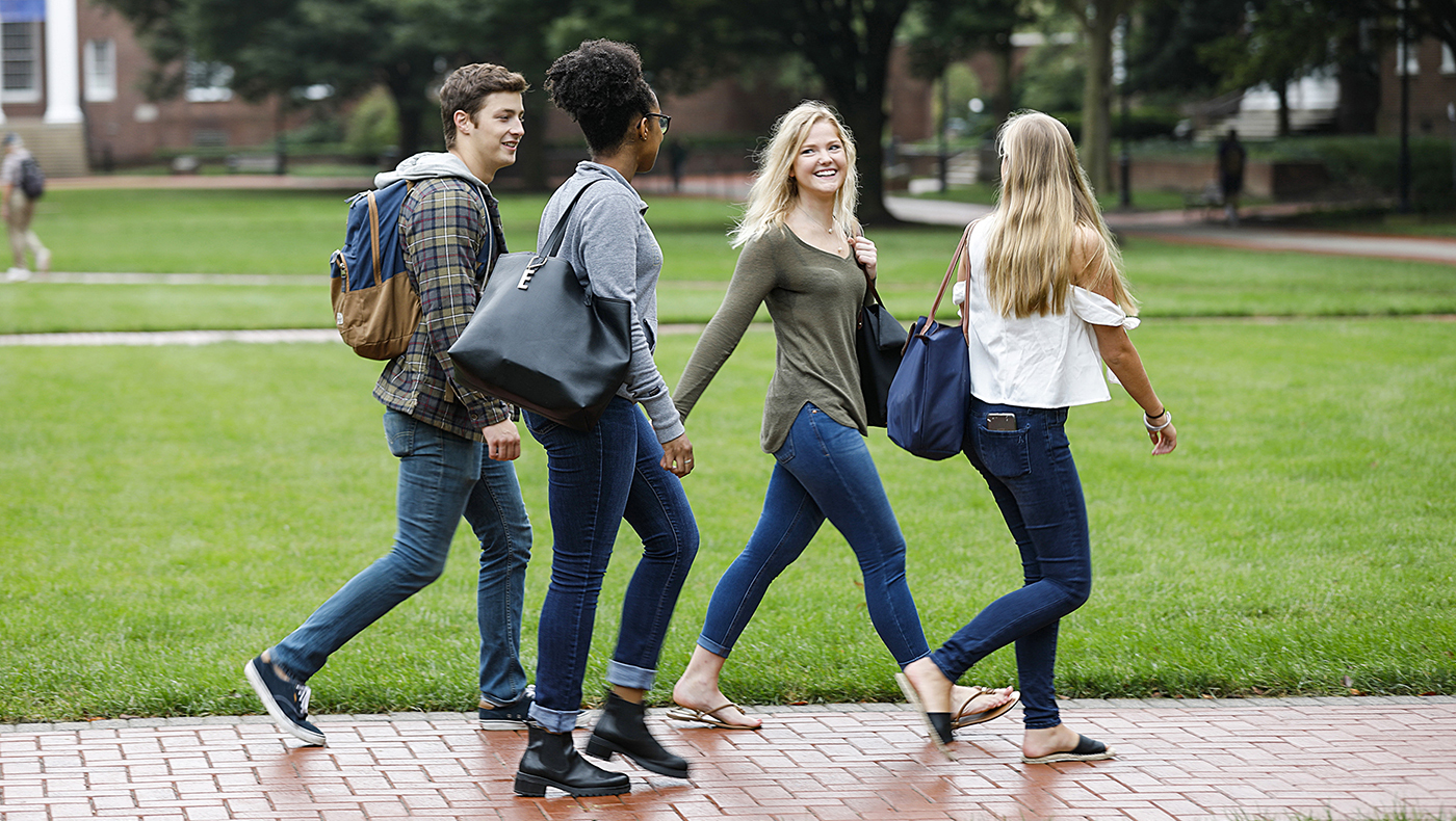 Classmates walk through campus