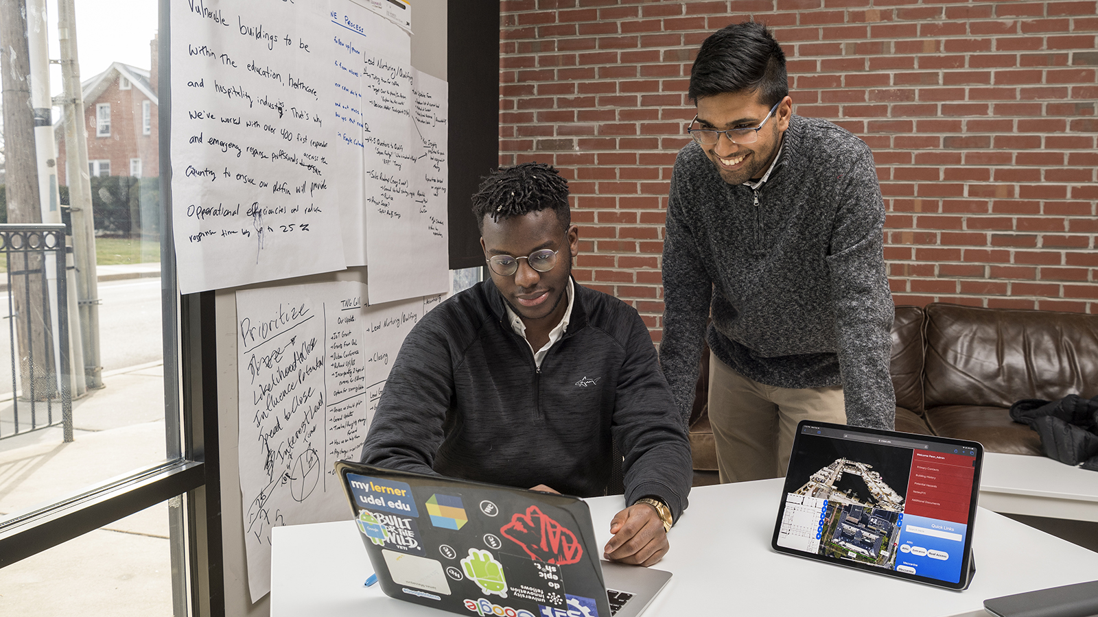 Two students work together at a computer