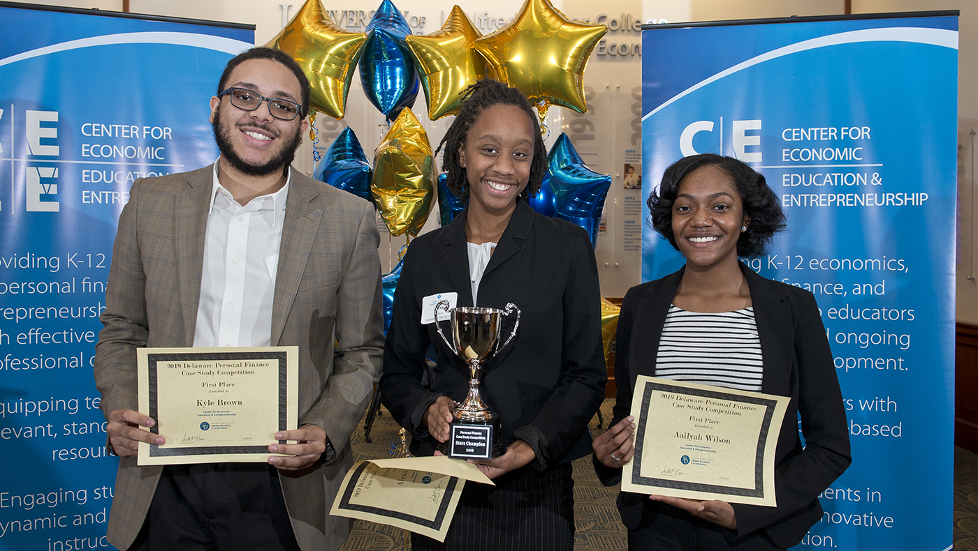 Kyle Brown, Alexa Freeman and Aaliyah Wilson from Middletown High School win the first Delaware Personal Finance Case Study Competition.