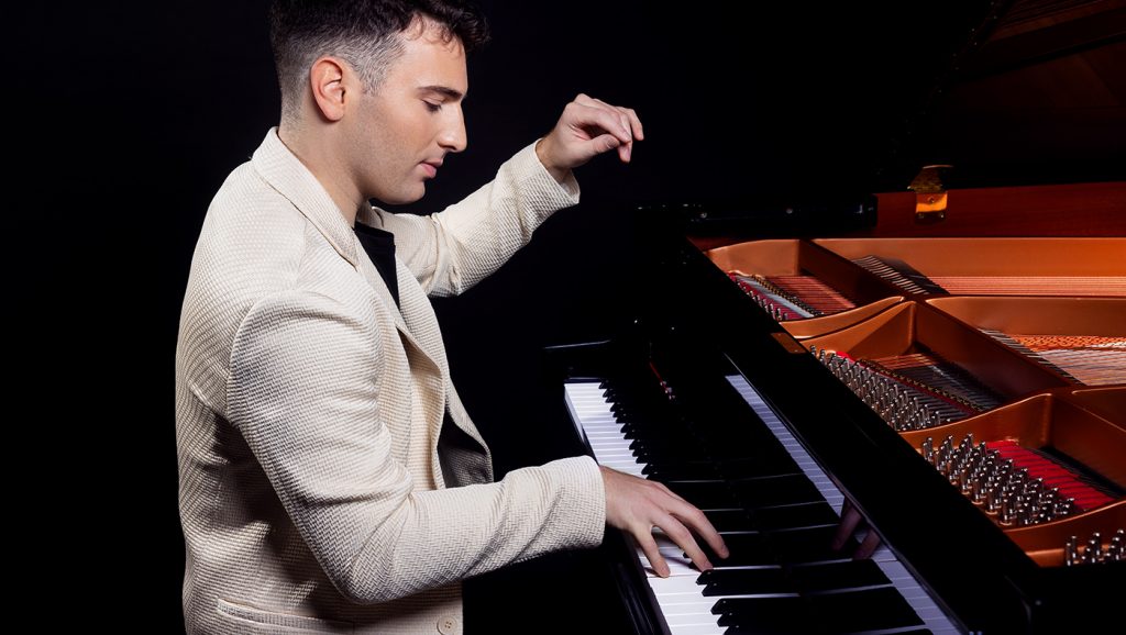 University of Delaware Accounting Grad Daniel Wallen playing the piano