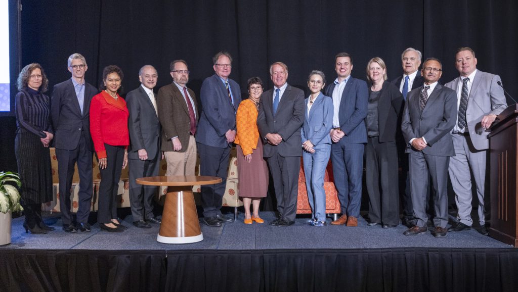 Contributing authors of Boardroom Legacy gather around Weinberg Center Director Larry Cunningham (center) at UD’s Clayton Hall, where they presented insights on the evolution of corporate governance and the center’s 25-year history.