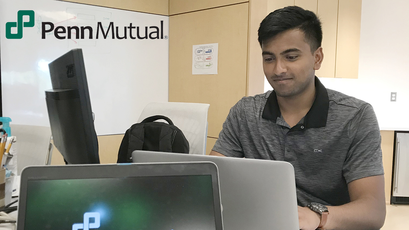 Nishant Chintala, works at his computer as a business transformation intern at Penn Mutual.