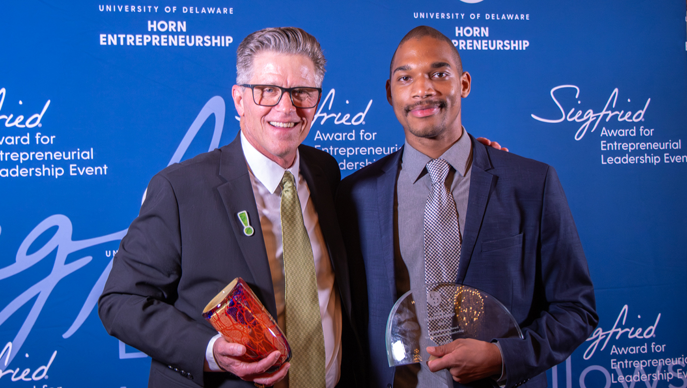 Dave Raymond and Nasir Young pose with their awards at the Siegfried Entrepreneurial Leadership Dinner.