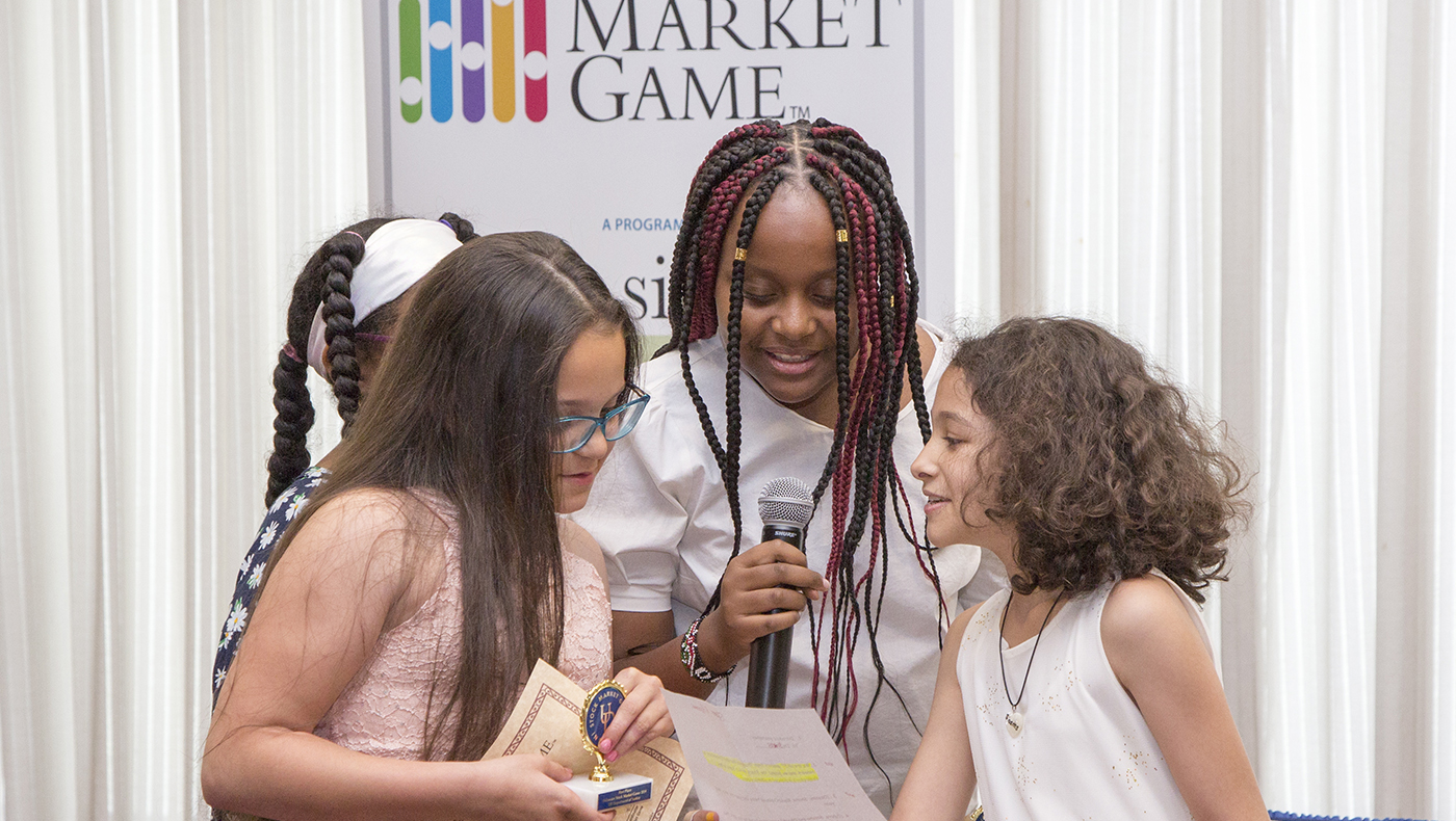 UD’s Alfred Lerner College of Business and Economics sponsors the Stock Market Game for elementary, middle and high school students in Delaware. Pictured above is the fourth through sixth grade division accepting their award.