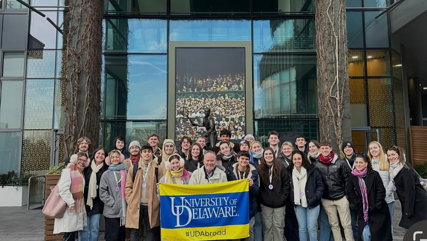 UD sport management students in front of entrance to Wimbledon's Centre Court.