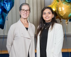 Pictured (l to r) Michele Lynch, retired managing director for Accenture and Riddhi Patel, Class of 2023, master of science in business analytics and information management.